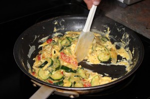 Pull sides in to help distribute eggs. Fold until evenly cooked. 